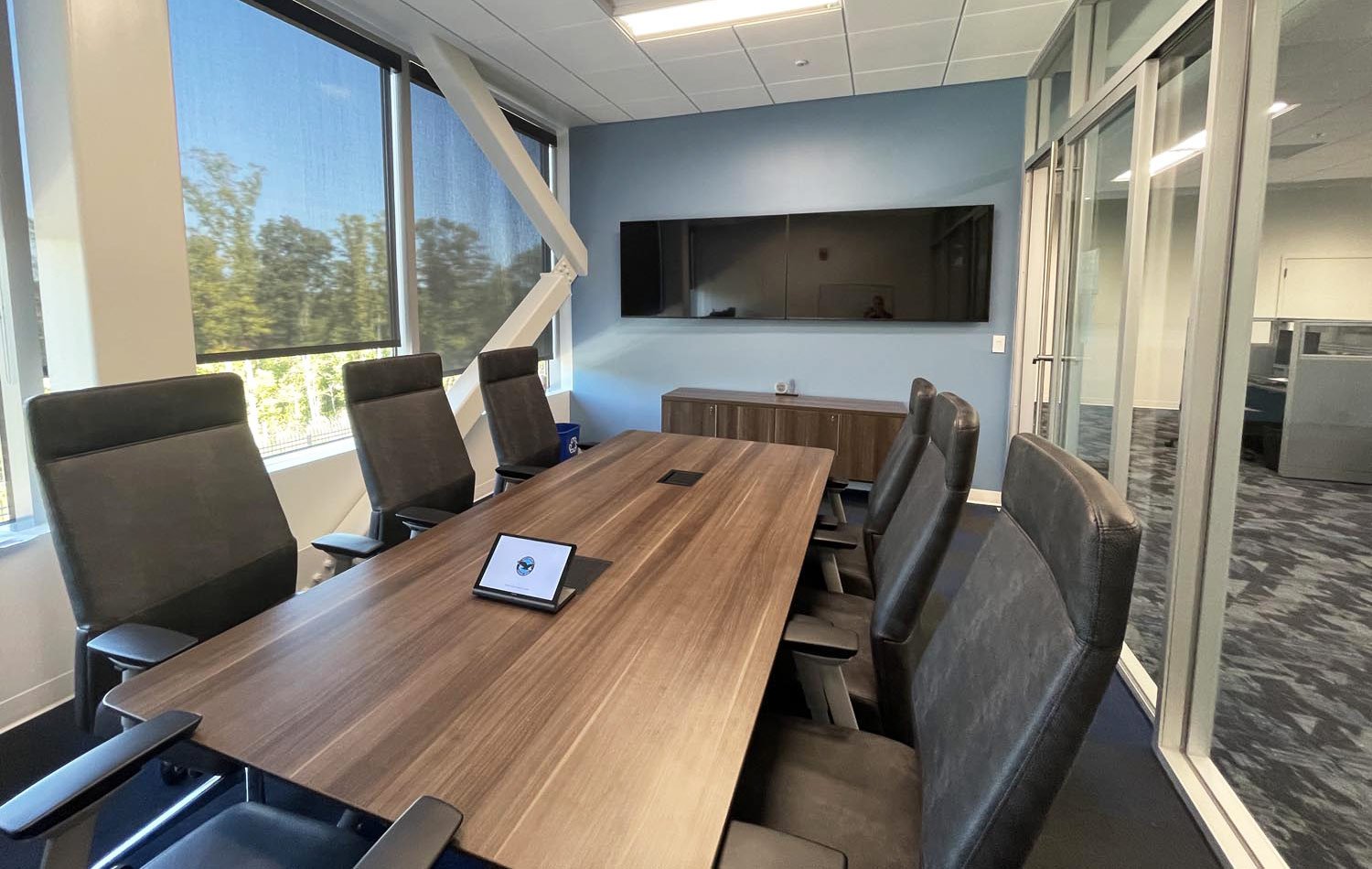 Aerospace manufacturing conference room with dual displays